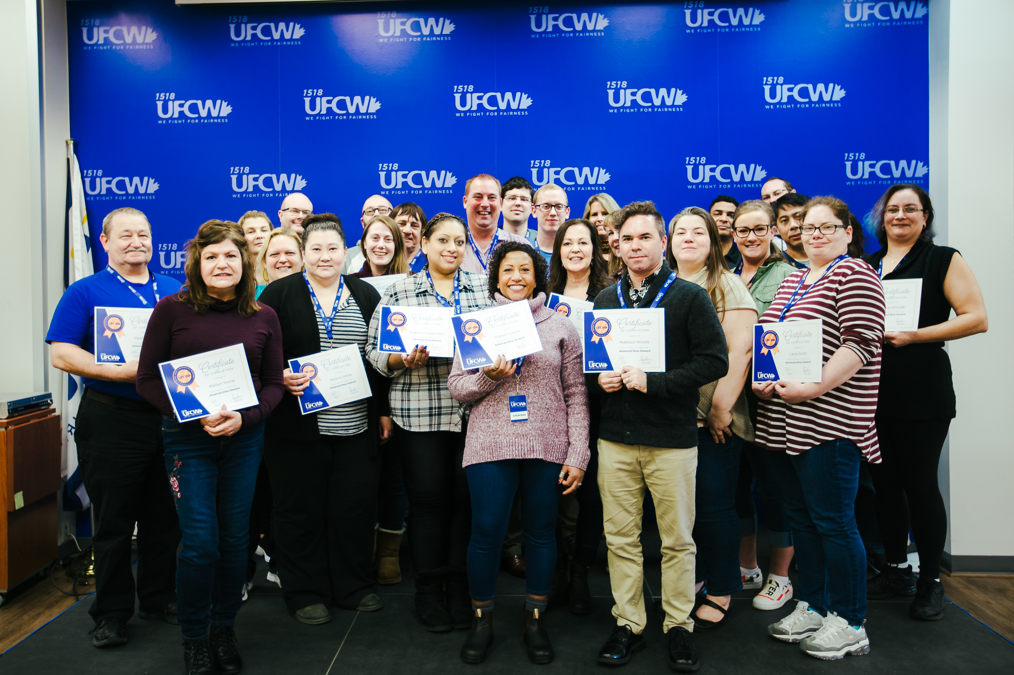 UFCW Members stand with course certificates